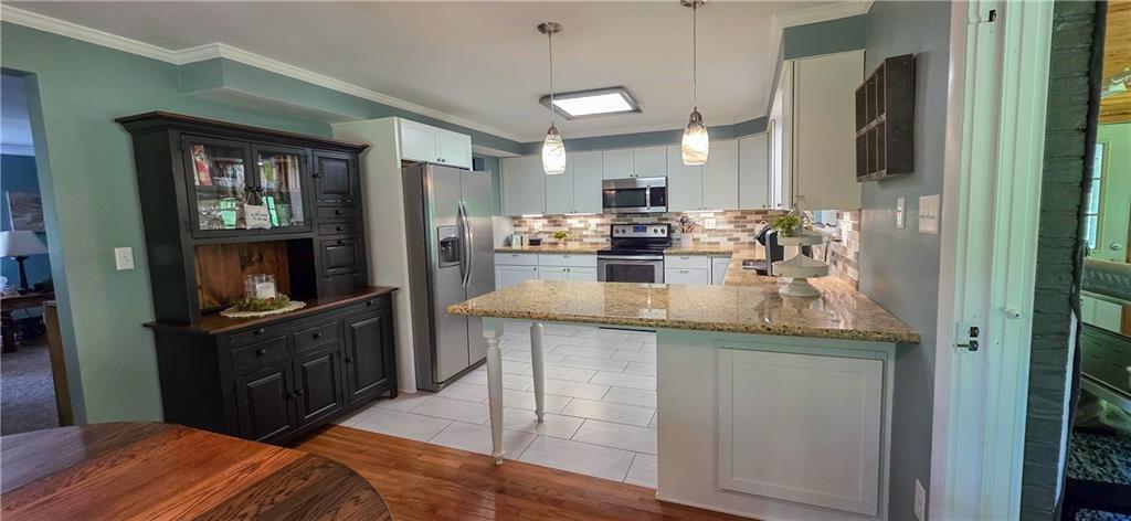 532 Strope Road Burgettstown, PA 15021 - Photo 2 of 20 a kitchen with refrigerator and cabinets