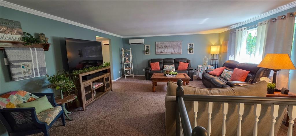 532 Strope Road Burgettstown, PA 15021 - Photo 8 of 20 a living room with furniture and a flat screen tv