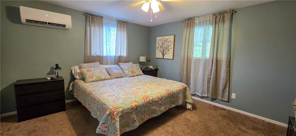 532 Strope Road Burgettstown, PA 15021 - Photo 10 of 20 a bedroom with a bed and a chandelier