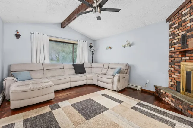 a living room with furniture and a rug
