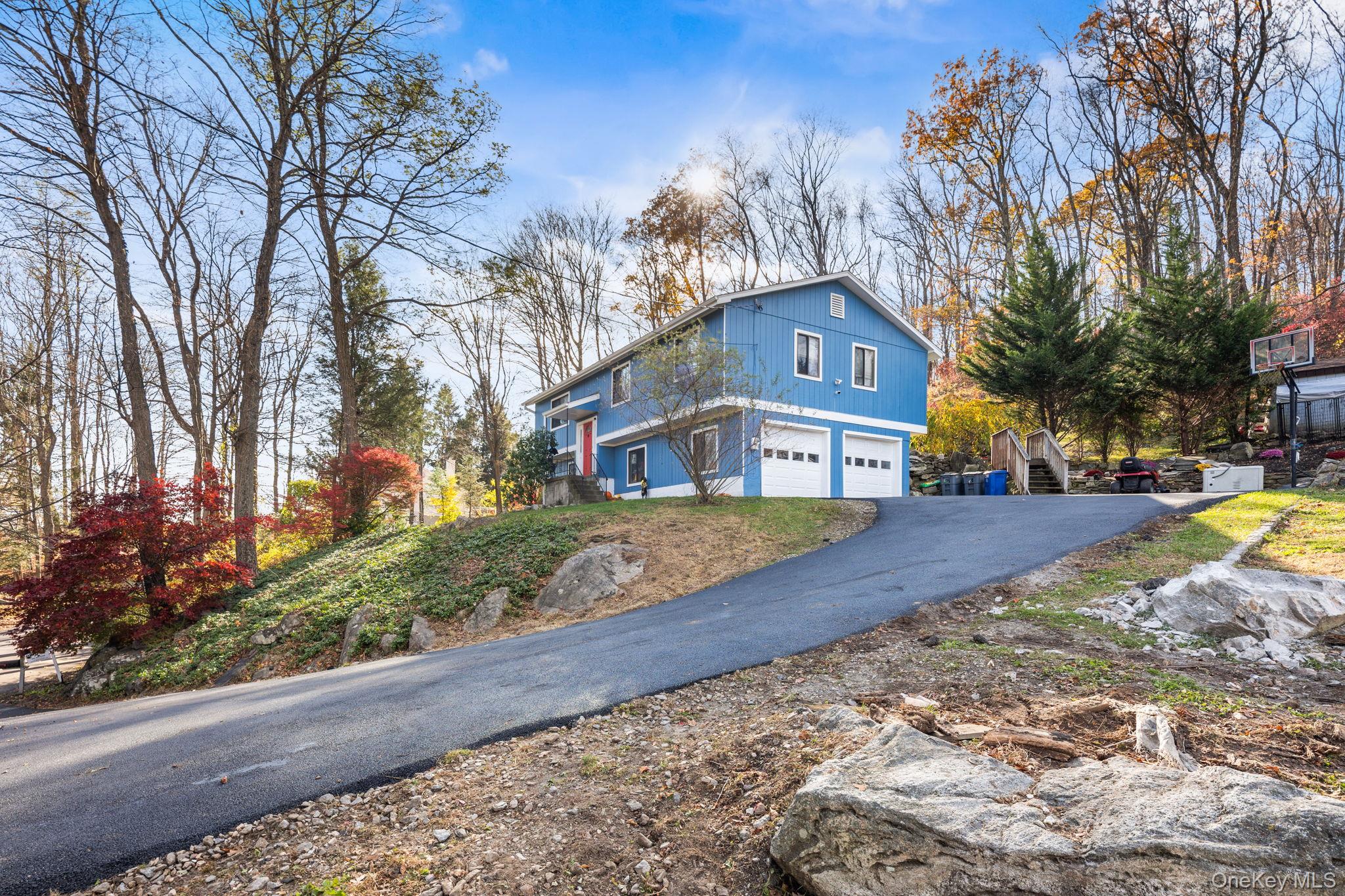 97 Old Road Brewster, NY 10509 - Photo 23 of 23 View of front facade featuring asphalt driveway and a garage