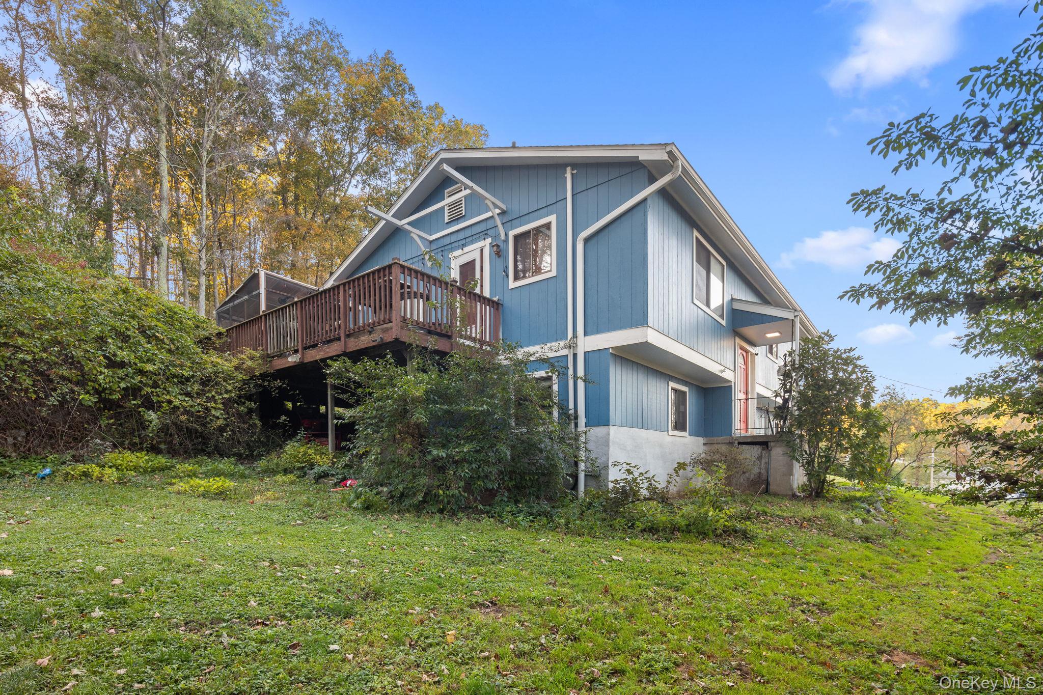 97 Old Road Brewster, NY 10509 - Photo 4 of 23 View of home's exterior with a yard and a wooden deck