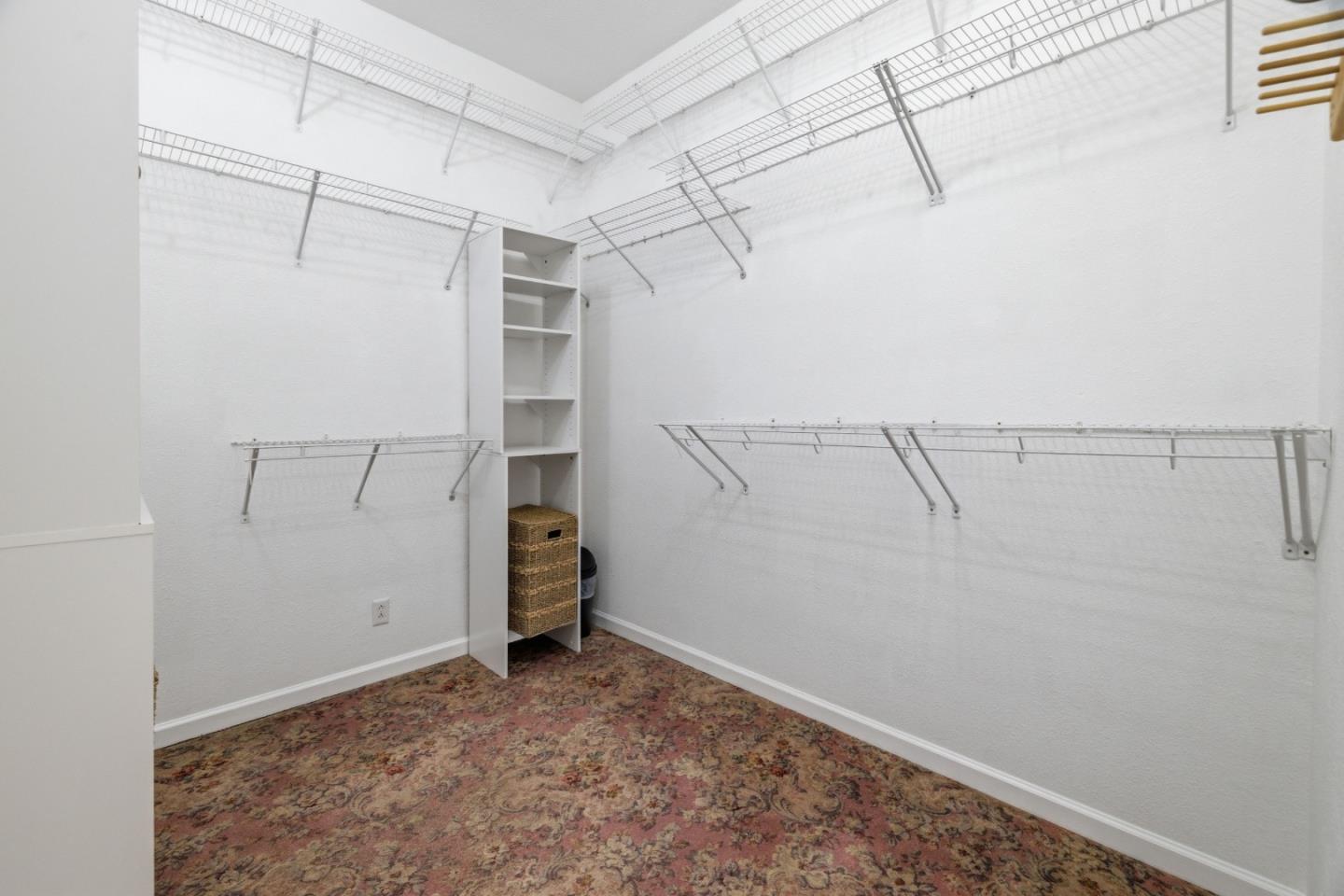 19269 Mallory Canyon Road, Unit D Salinas, CA 93907 - Photo 26 of 77 a view of walk in closet with empty racks
