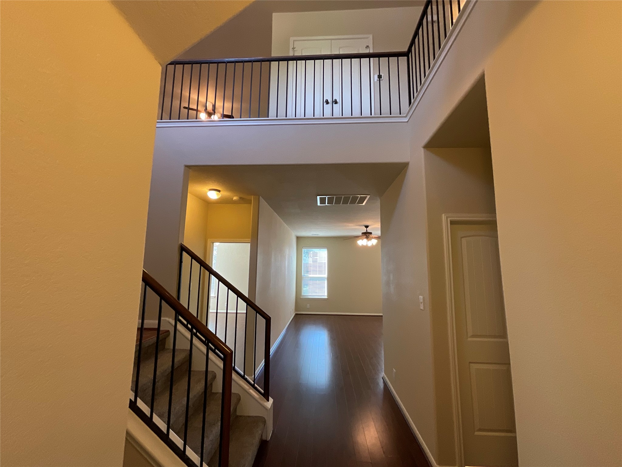 1911 Conn Creek Road Cedar Park, TX 78613 - Photo 7 of 39 a view of staircase with wooden floor and a front door
