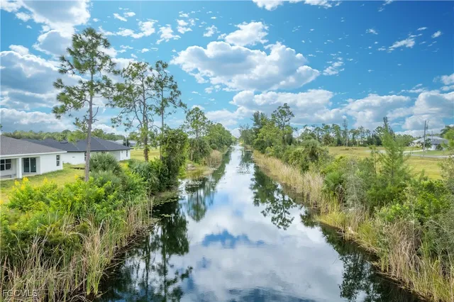 a view of a lake with a yard