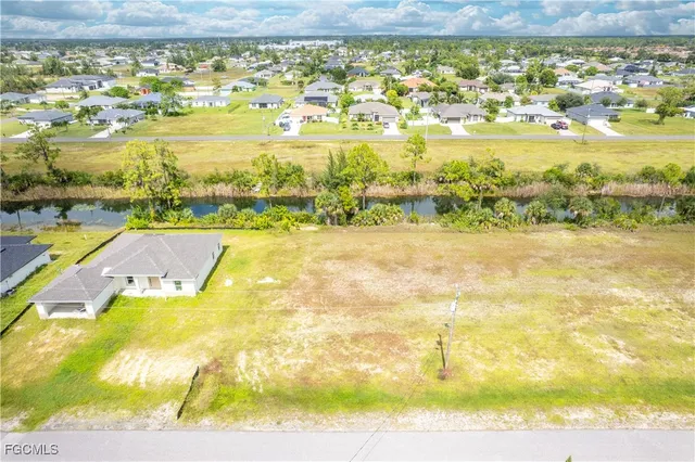 a view of a lake with a yard