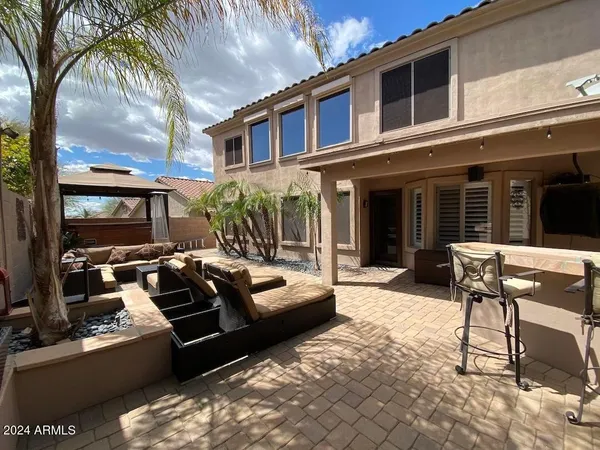 a view of a house with backyard porch and patio
