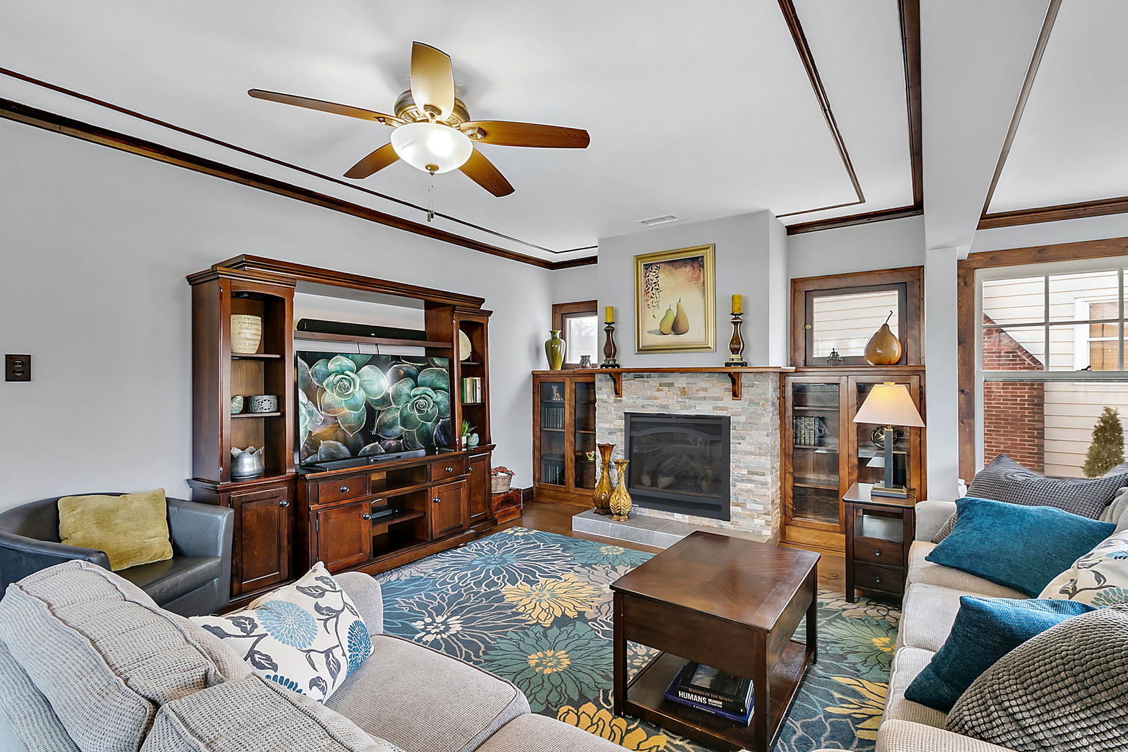 257 Herrick Road Riverside, IL 60546 - Photo 3 of 34 a living room with furniture and a fireplace