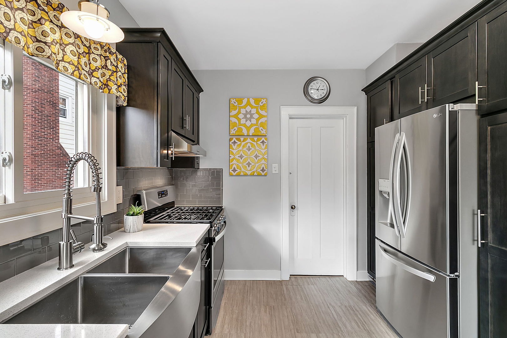 257 Herrick Road Riverside, IL 60546 - Photo 9 of 34 a kitchen with stainless steel appliances granite countertop a refrigerator and a sink