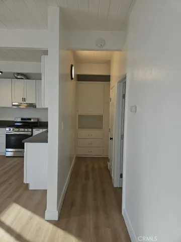 a view of a kitchen from the hallway