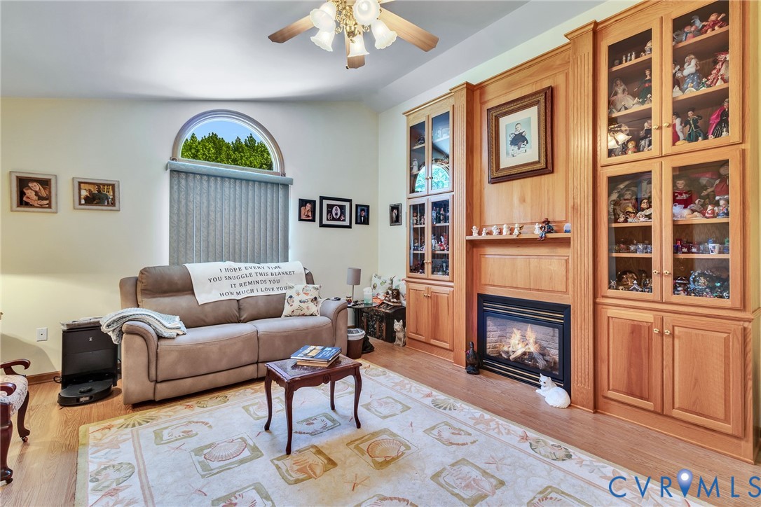 4400 Hacks Neck Road Heathsville, VA 22473 - Photo 31 of 78 a living room with furniture a couch and a bookshelf