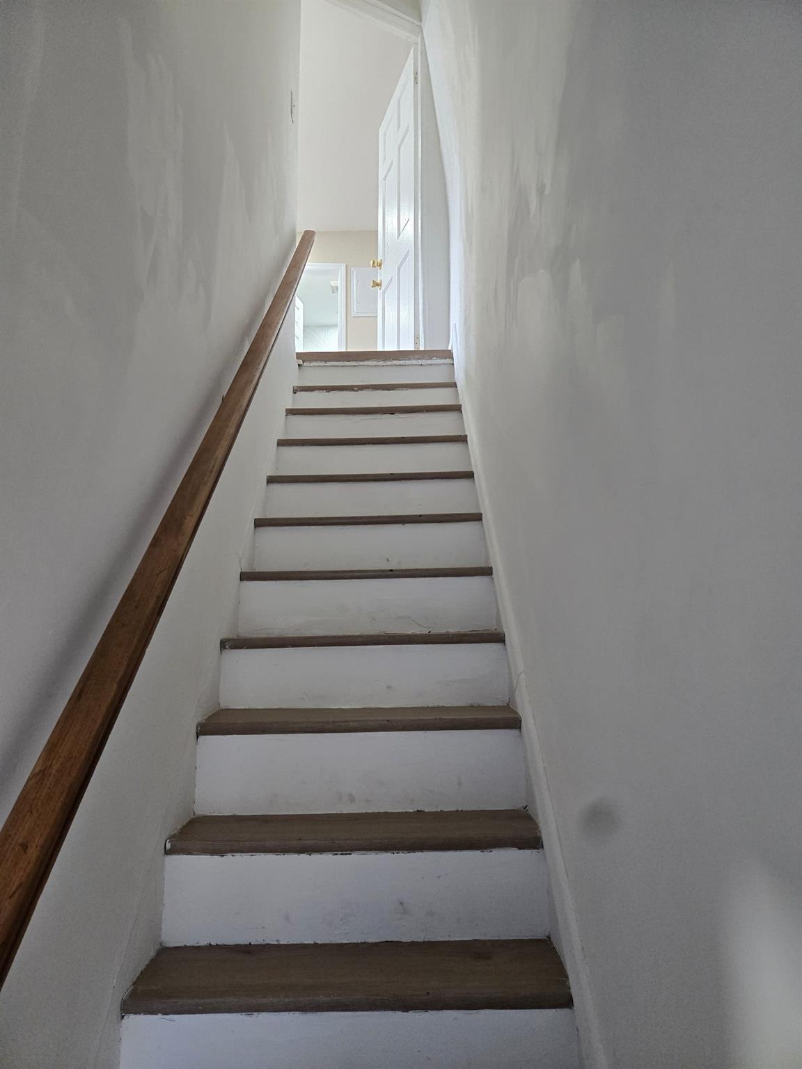 35-14 109th Street Queens, NY 11368 - Photo 17 of 38 Staircase featuring wood finished floors
