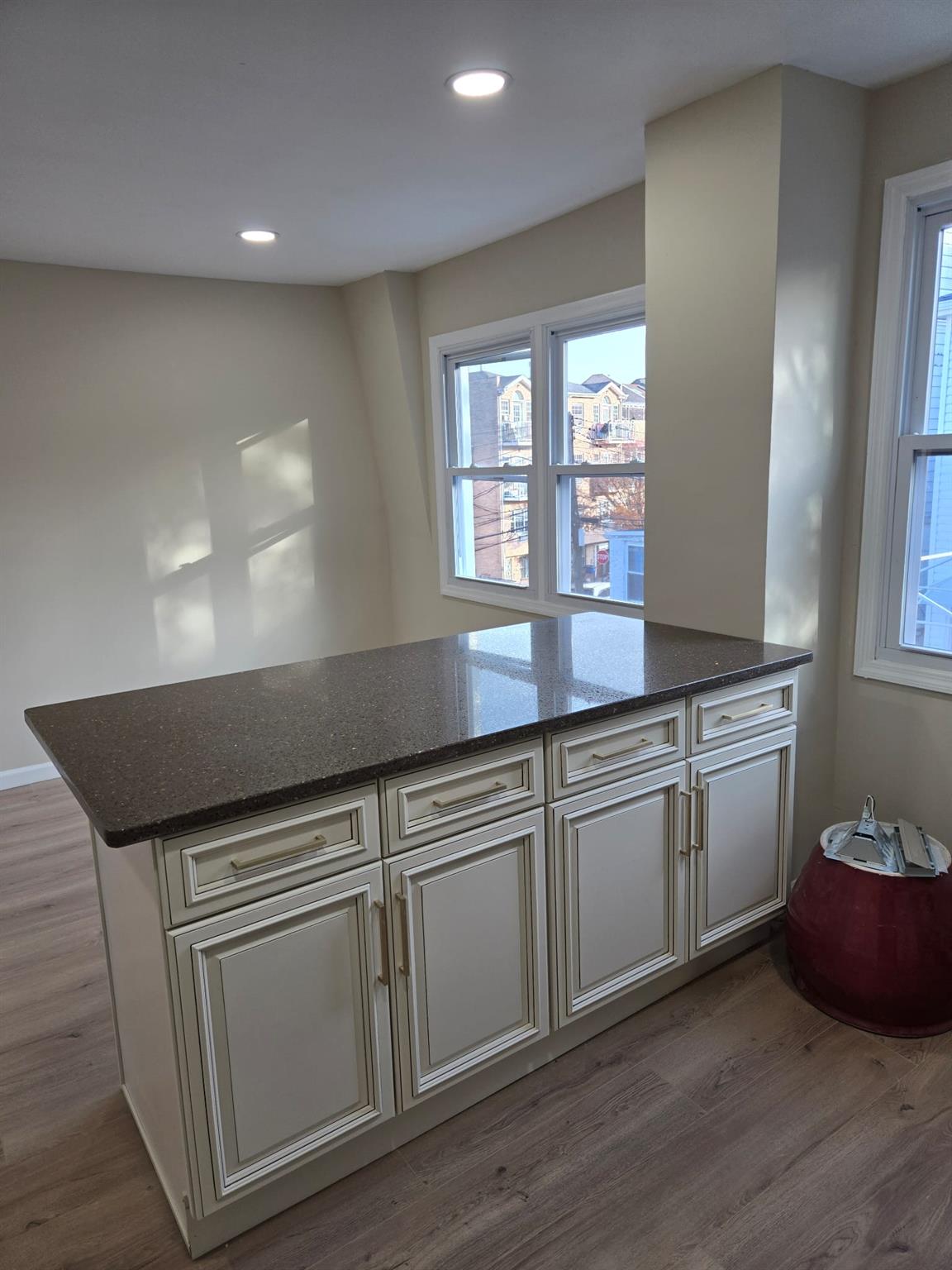 35-14 109th Street Queens, NY 11368 - Photo 23 of 38 Kitchen with dark stone countertops, wood finished floors, and recessed lighting
