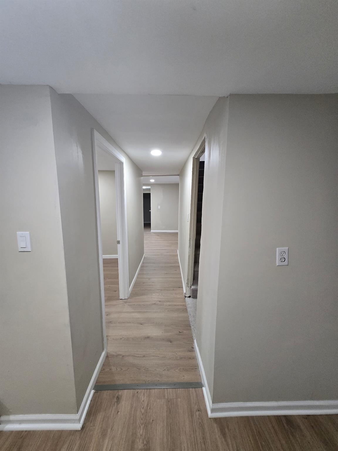 35-14 109th Street Queens, NY 11368 - Photo 32 of 38 Hallway featuring baseboards and light wood-style floors