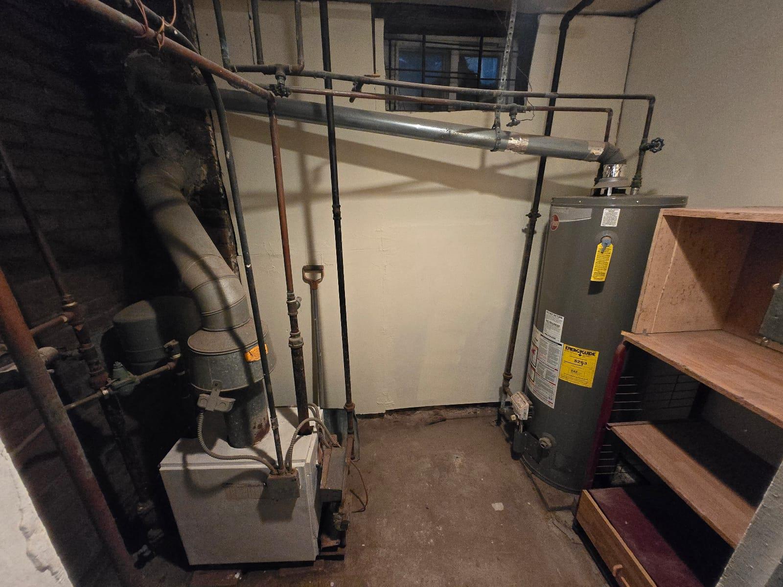 35-14 109th Street Queens, NY 11368 - Photo 34 of 38 Utilities with gas water heater