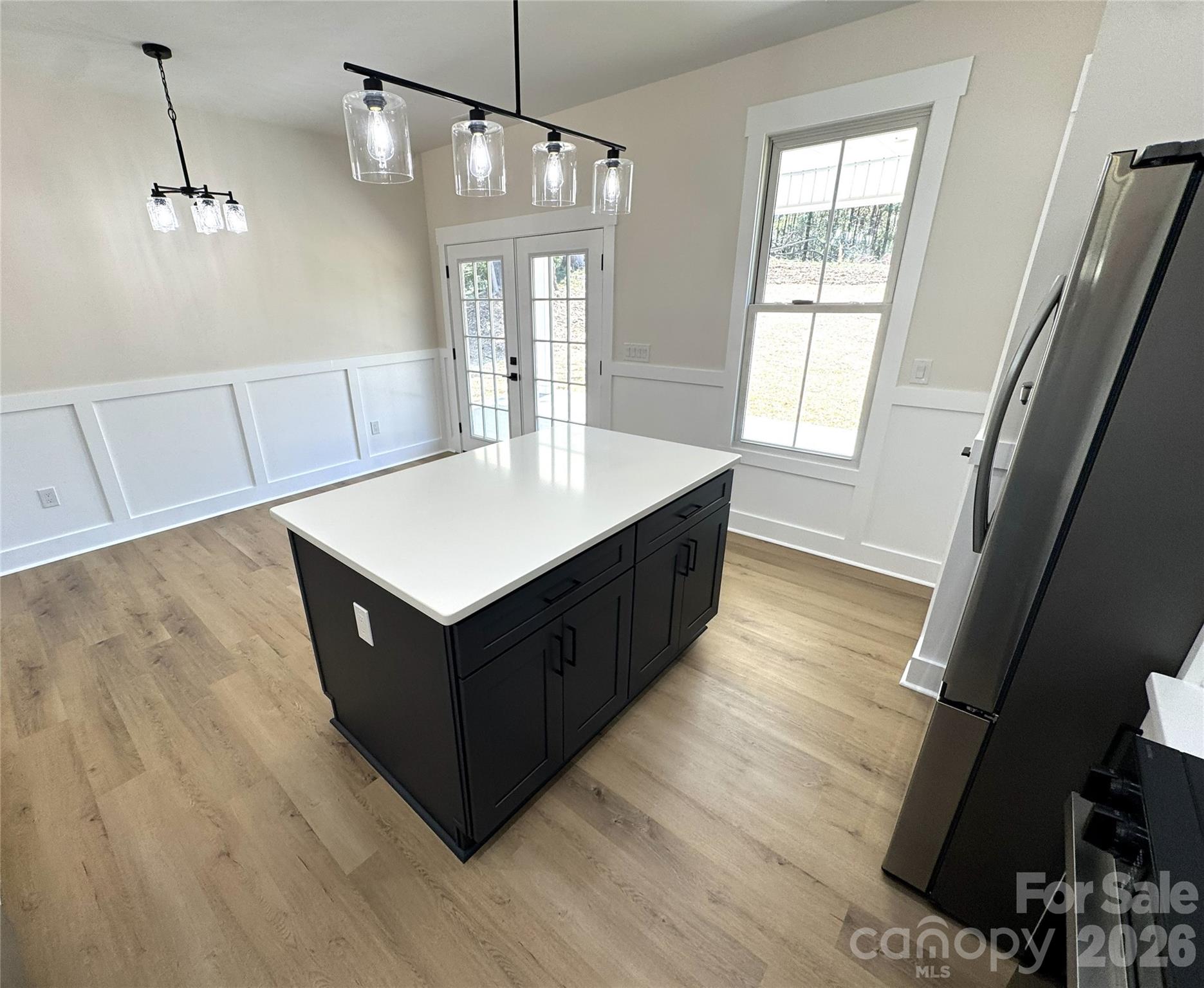 613 Bethany Road Albemarle, NC 28001 - Photo 7 of 26 a kitchen with wooden cabinets and window