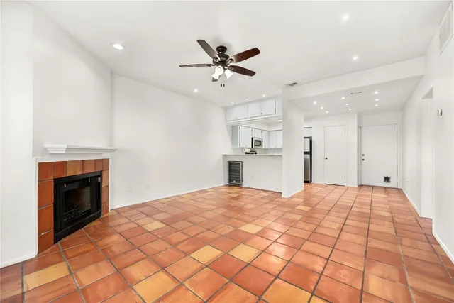 a bedroom with a bed and a fireplace