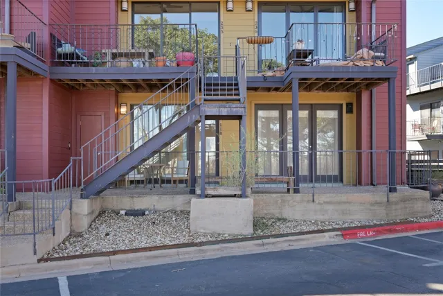 a view of a building with a small yard