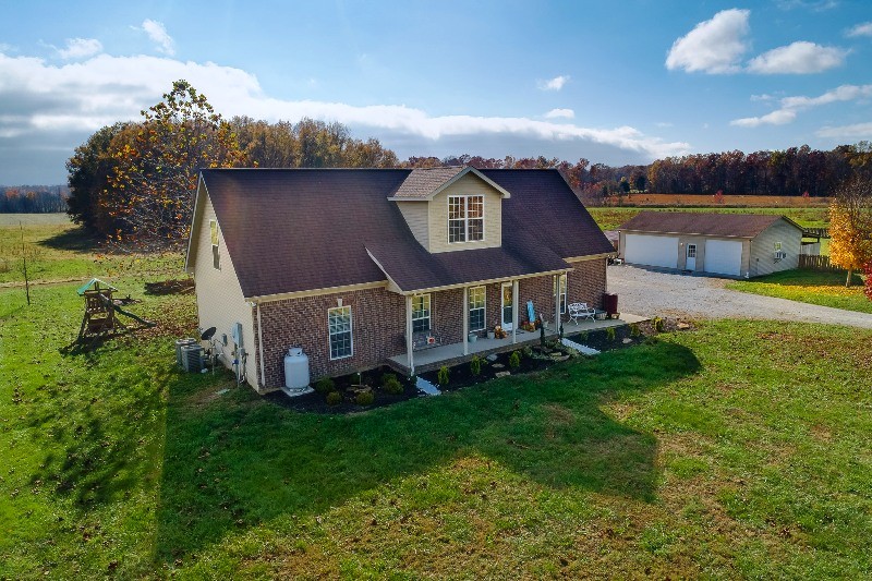 987 Boynton Valley Road Manchester, TN 37355 - Photo 1 of 38 a aerial view of a house with a big yard and large trees