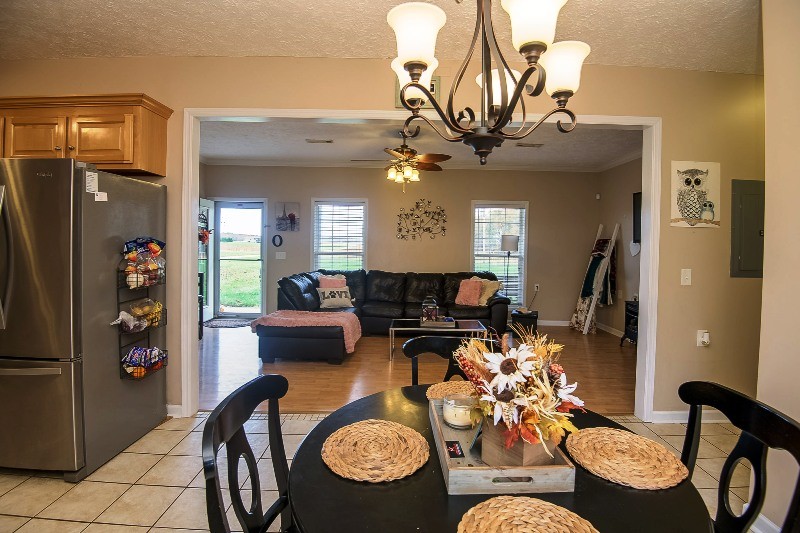 987 Boynton Valley Road Manchester, TN 37355 - Photo 12 of 38 a view of a dining room with furniture and a chandelier