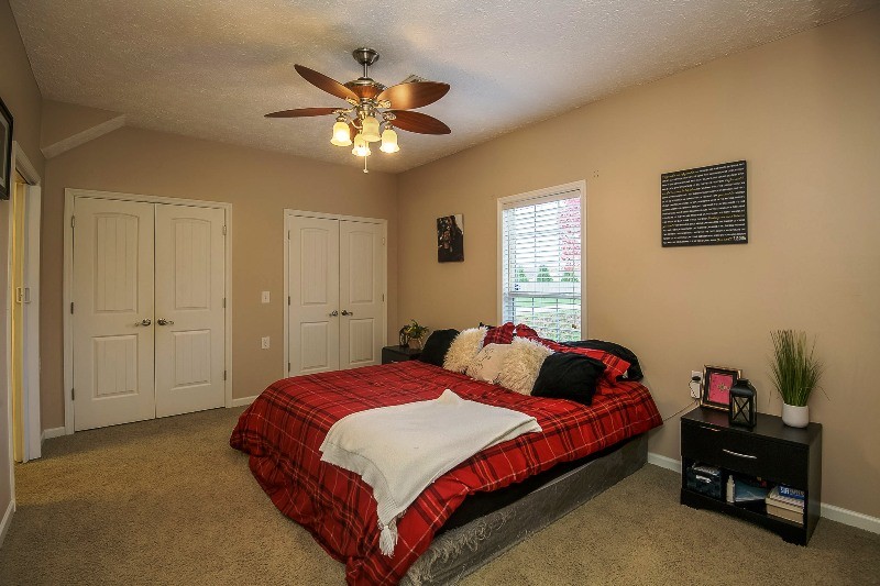987 Boynton Valley Road Manchester, TN 37355 - Photo 13 of 38 a bedroom with a bed and a chandelier