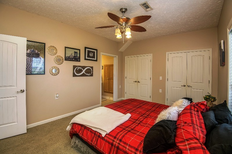 987 Boynton Valley Road Manchester, TN 37355 - Photo 14 of 38 a bedroom with a bed and a chandelier