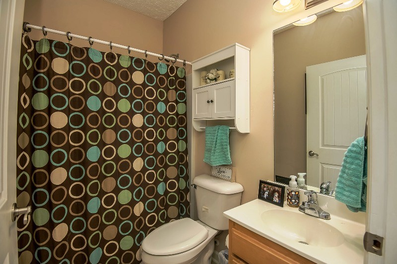 987 Boynton Valley Road Manchester, TN 37355 - Photo 22 of 38 a bathroom with a sink and a mirror