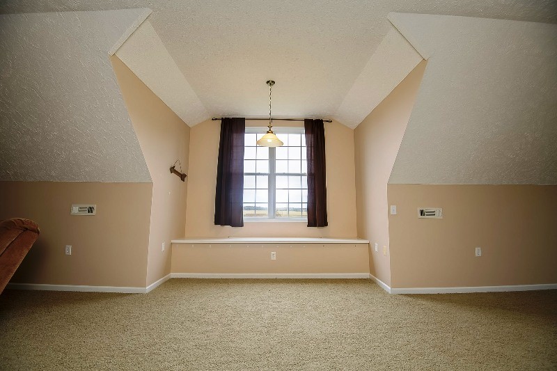 987 Boynton Valley Road Manchester, TN 37355 - Photo 25 of 38 an empty room with a fireplace and window