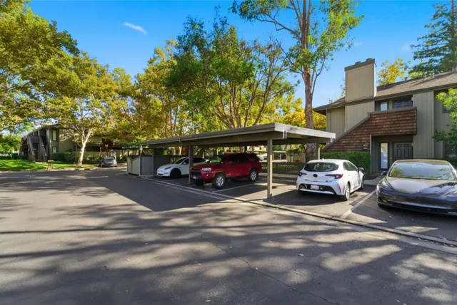 a view of parking space with cars parked