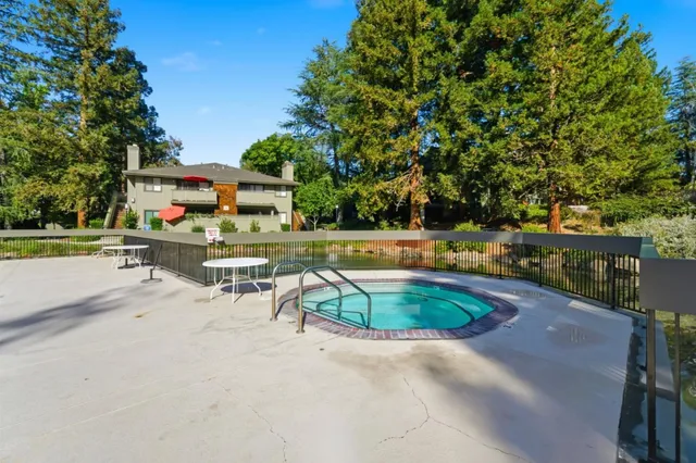 an aerial view of ocean residential house with outdoor space and trees all around