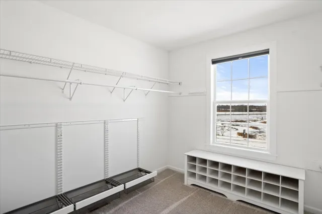 a room with a bed and a window