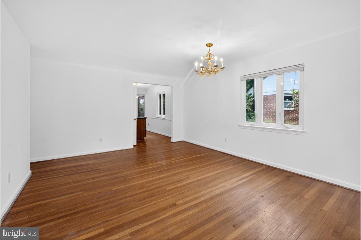 4068 Adams Drive Silver Spring, MD 20902 - Photo 9 of 43 a view of an empty room with wooden floor and a window