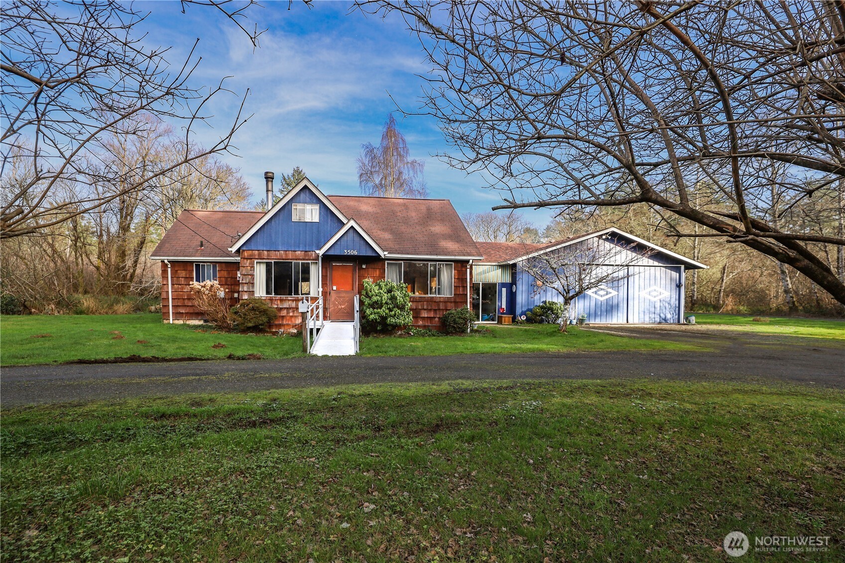 a front view of house with yard and green space