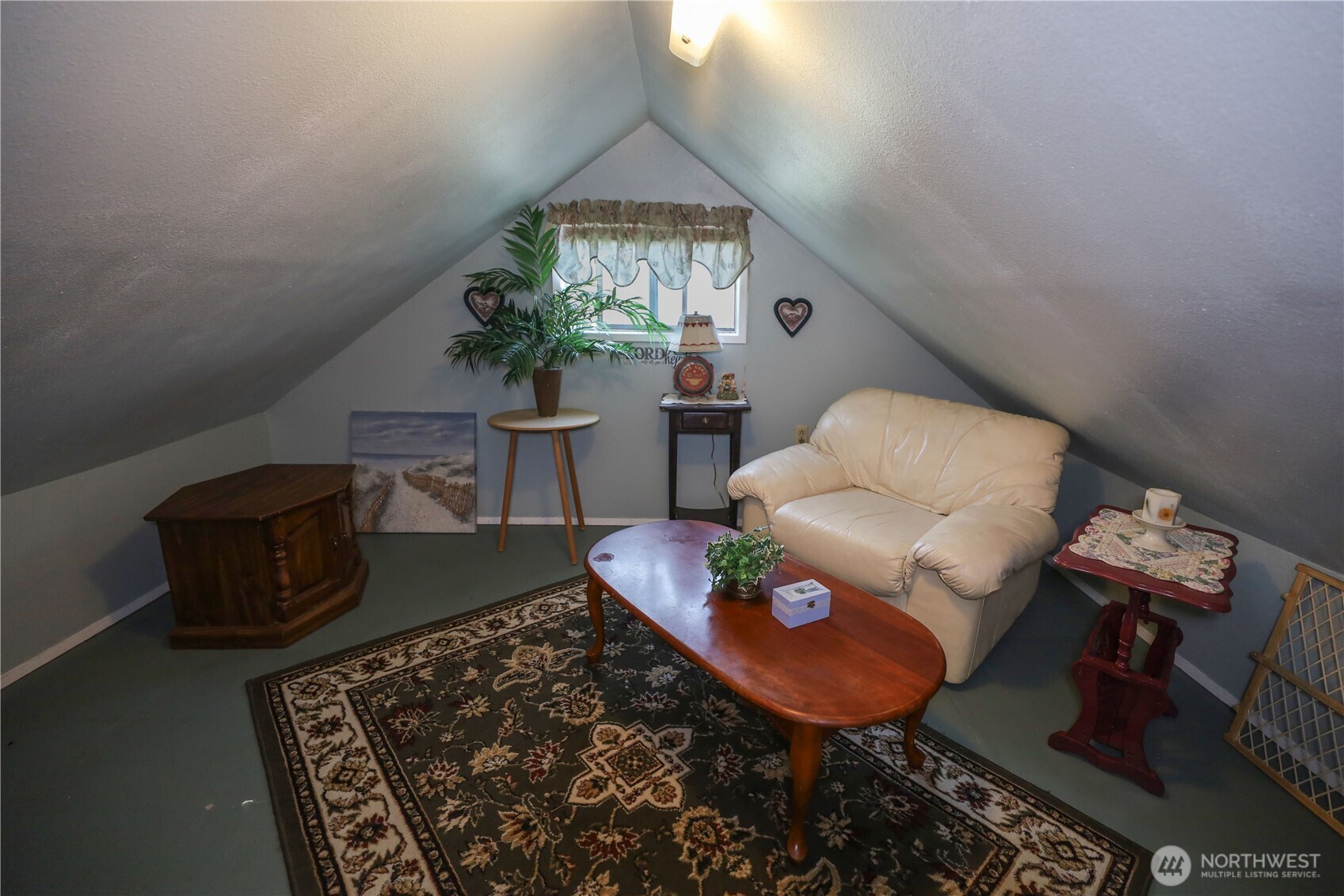 3506 SR 105 Grayland, WA 98547 - Photo 17 of 25 a living room with furniture and a chandelier