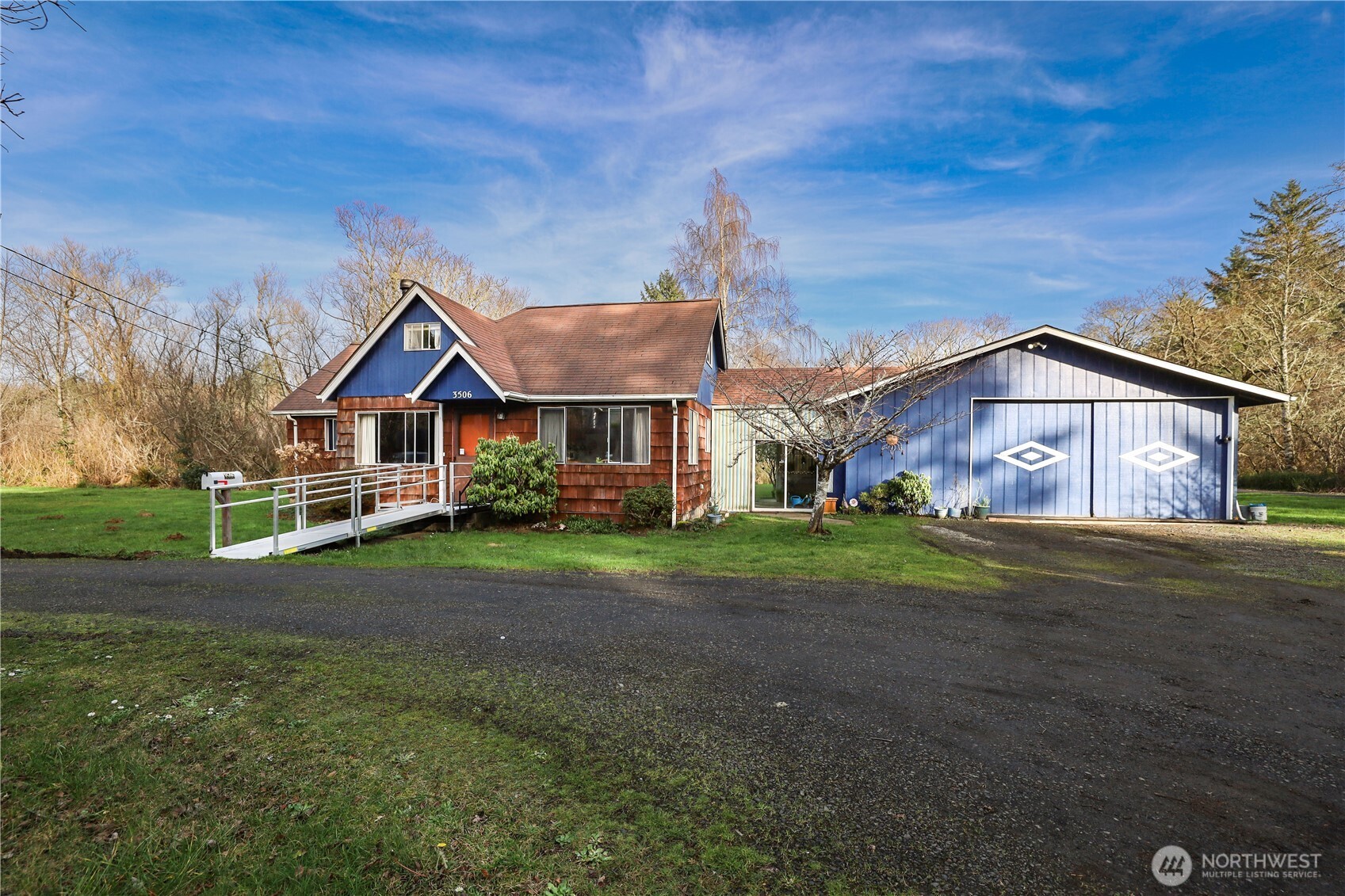 3506 SR 105 Grayland, WA 98547 - Photo 2 of 25 a front view of a house with garden