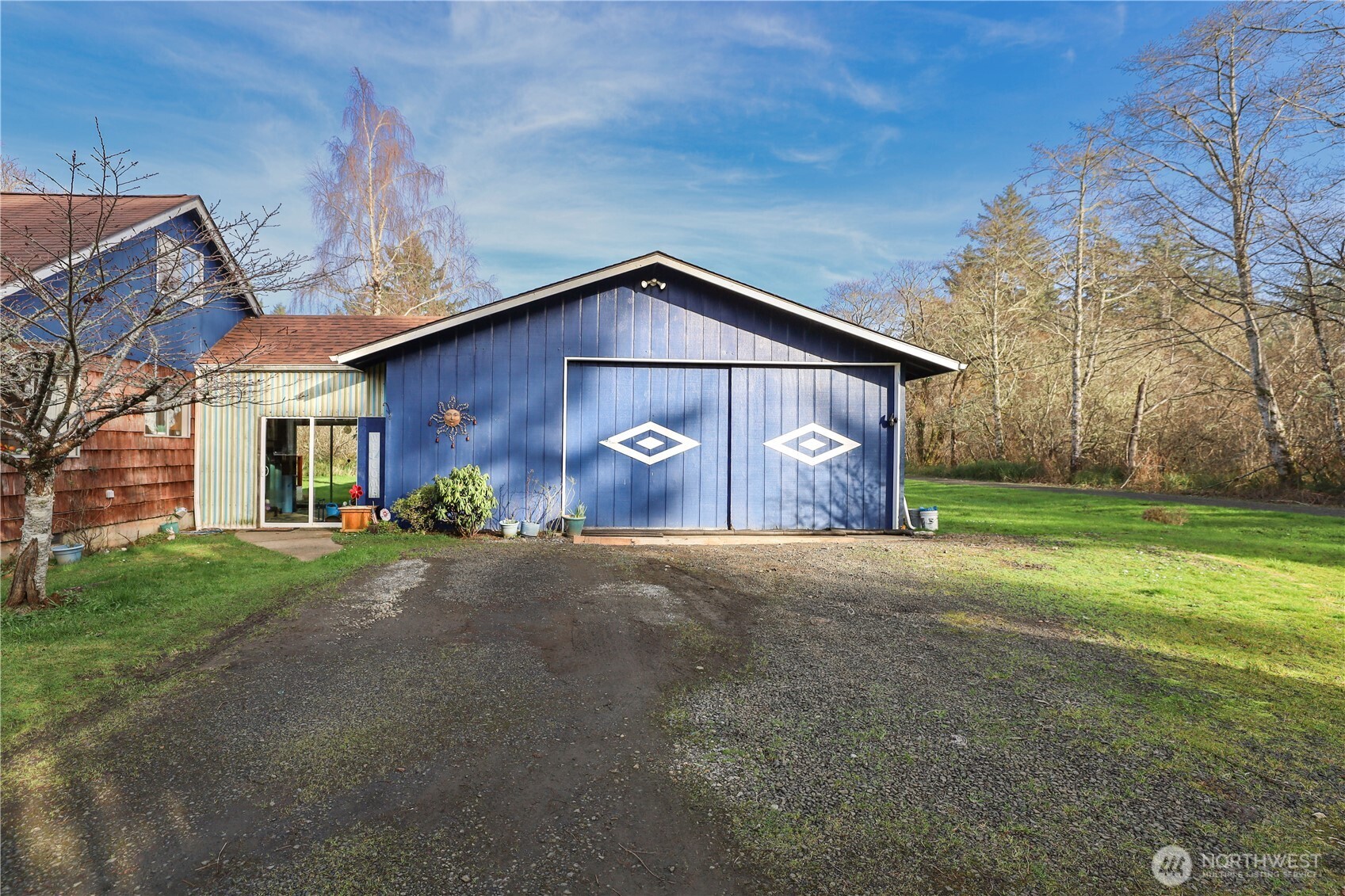 3506 SR 105 Grayland, WA 98547 - Photo 3 of 25 a front view of a house with a yard and garage