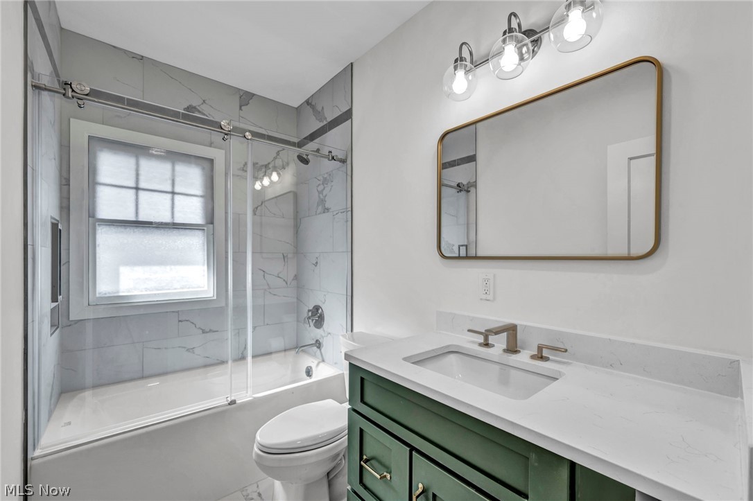 2135 Coventry Road, Unit DOWN Cleveland, OH 44118 - Photo 30 of 34 Full bath with vanity and bath / shower combo with glass door