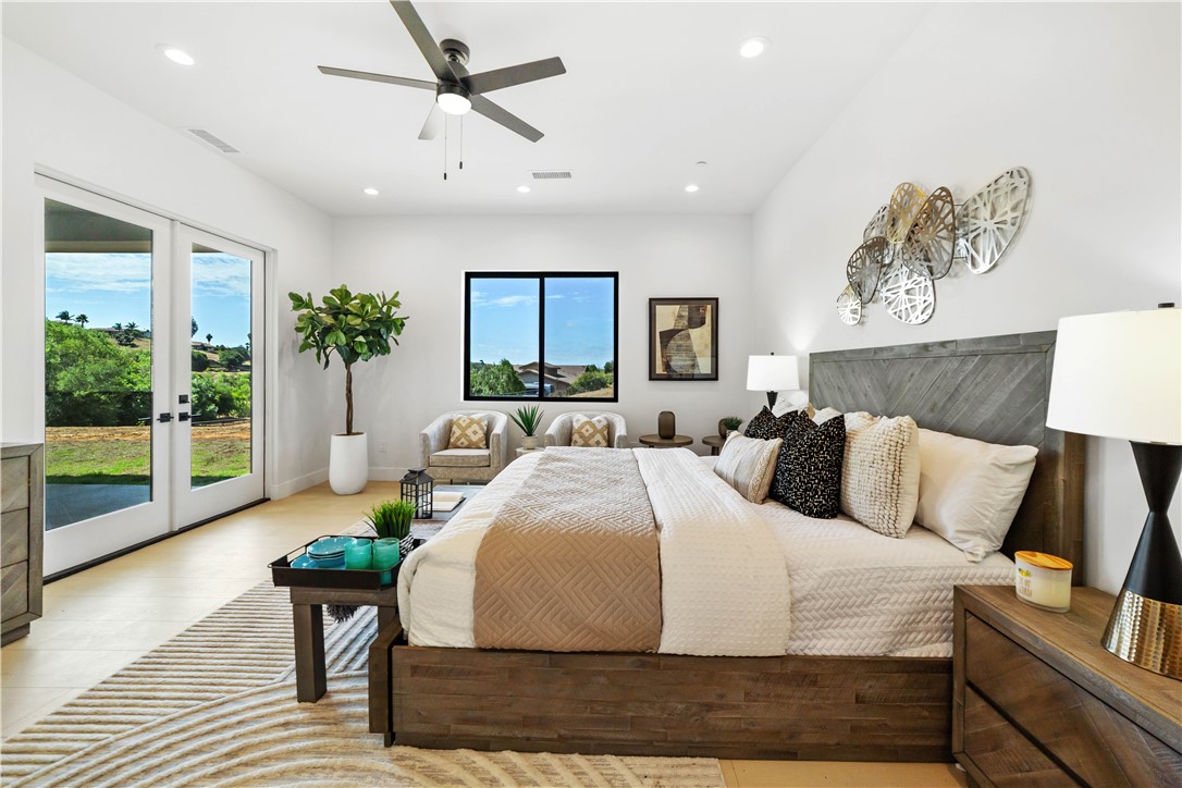 2027 Vía Monserate Fallbrook, CA 92028 - Photo 11 of 66 a bedroom with a bed and a large window