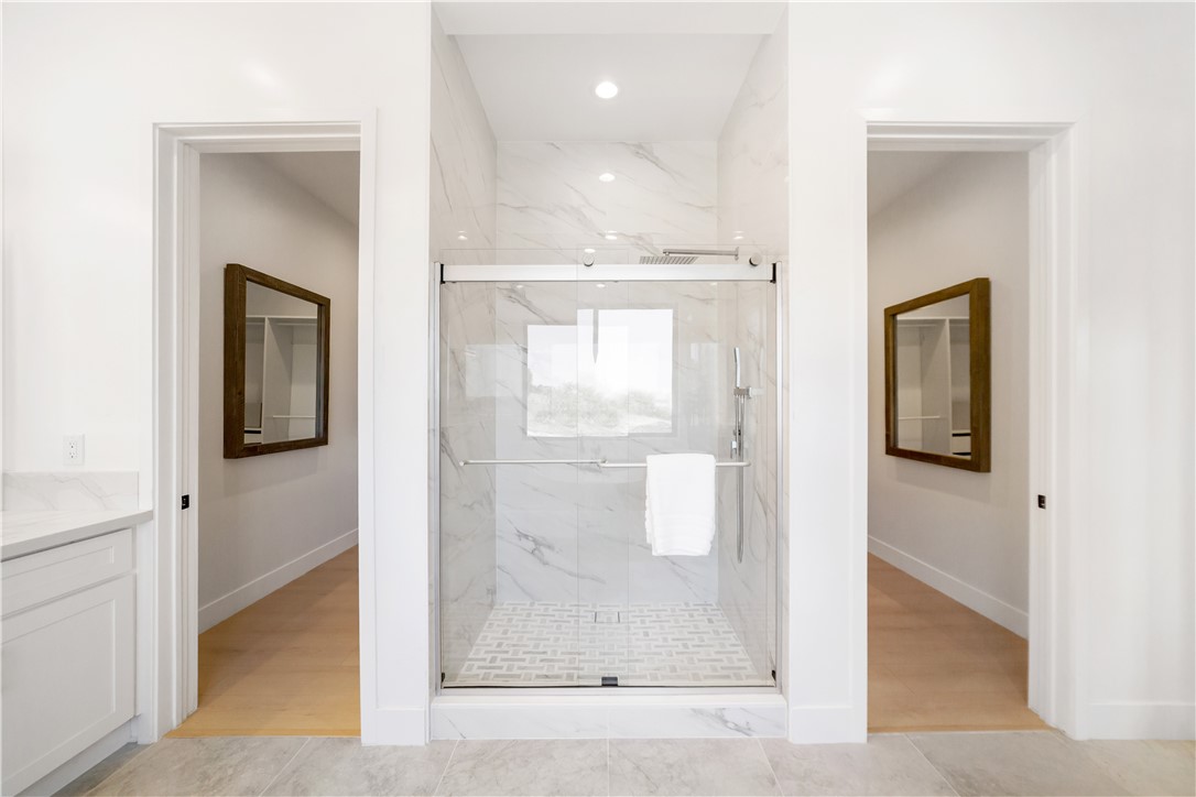 2027 Vía Monserate Fallbrook, CA 92028 - Photo 15 of 66 a view of a bathroom from a hallway
