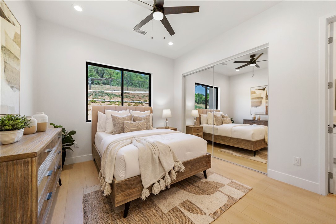 2027 Vía Monserate Fallbrook, CA 92028 - Photo 17 of 66 a bedroom with a bed and a couch