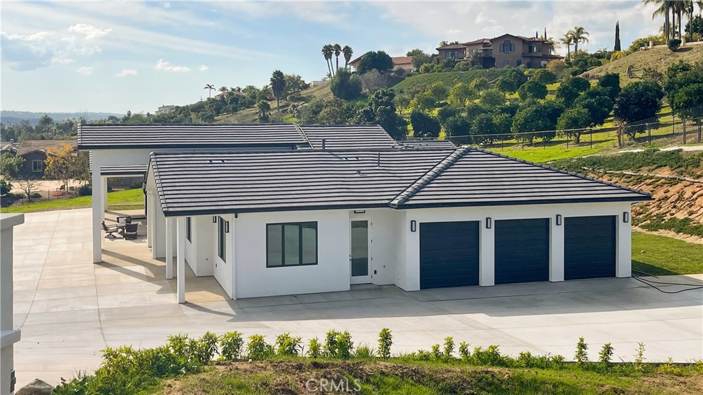 2027 Vía Monserate Fallbrook, CA 92028 - Photo 2 of 66 a house view with a garden space