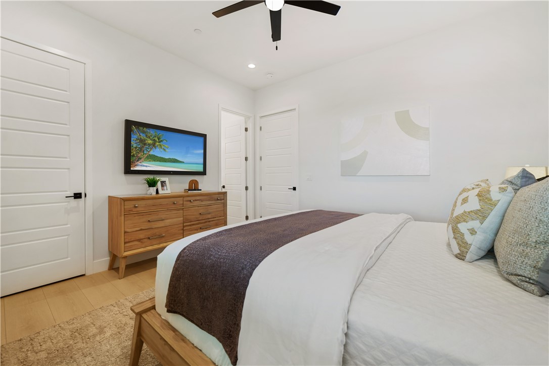 2027 Vía Monserate Fallbrook, CA 92028 - Photo 27 of 66 a bedroom with a bed and a flat screen tv