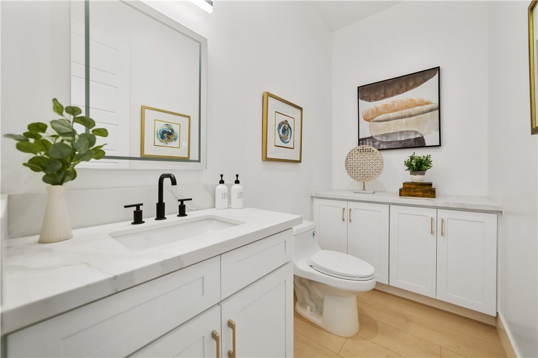 2027 Vía Monserate Fallbrook, CA 92028 - Photo 29 of 66 a bathroom with a toilet sink and mirror