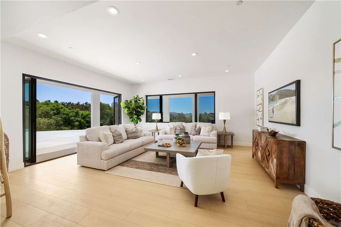 2027 Vía Monserate Fallbrook, CA 92028 - Photo 30 of 66 a living room with furniture and a large window