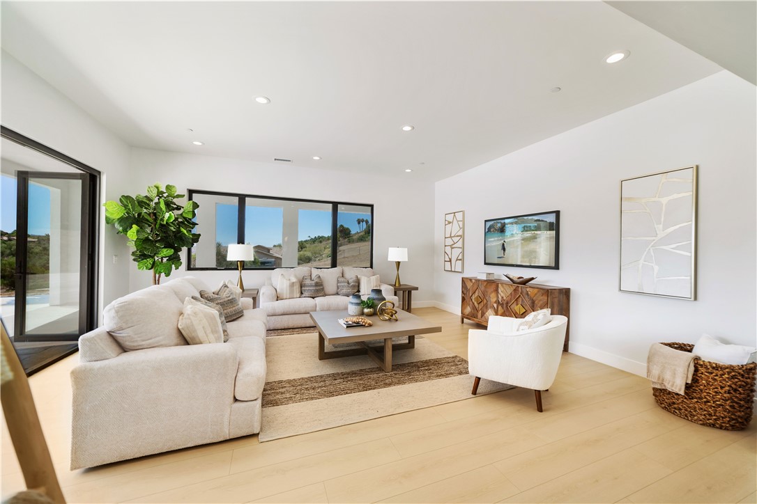 2027 Vía Monserate Fallbrook, CA 92028 - Photo 31 of 66 a living room with furniture and a large window