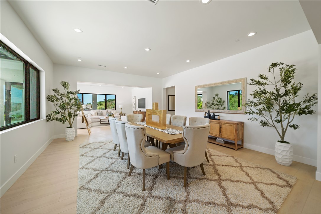 2027 Vía Monserate Fallbrook, CA 92028 - Photo 38 of 66 a living room with patio furniture and a potted plant