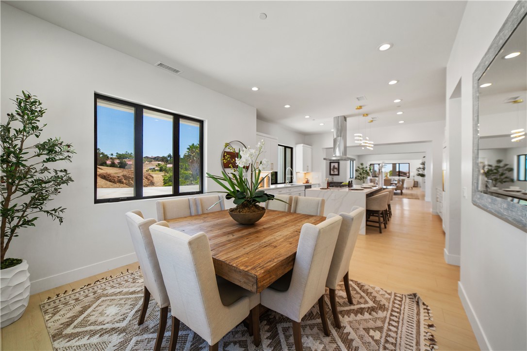 2027 Vía Monserate Fallbrook, CA 92028 - Photo 53 of 66 a view of a dining room with furniture window and wooden floor