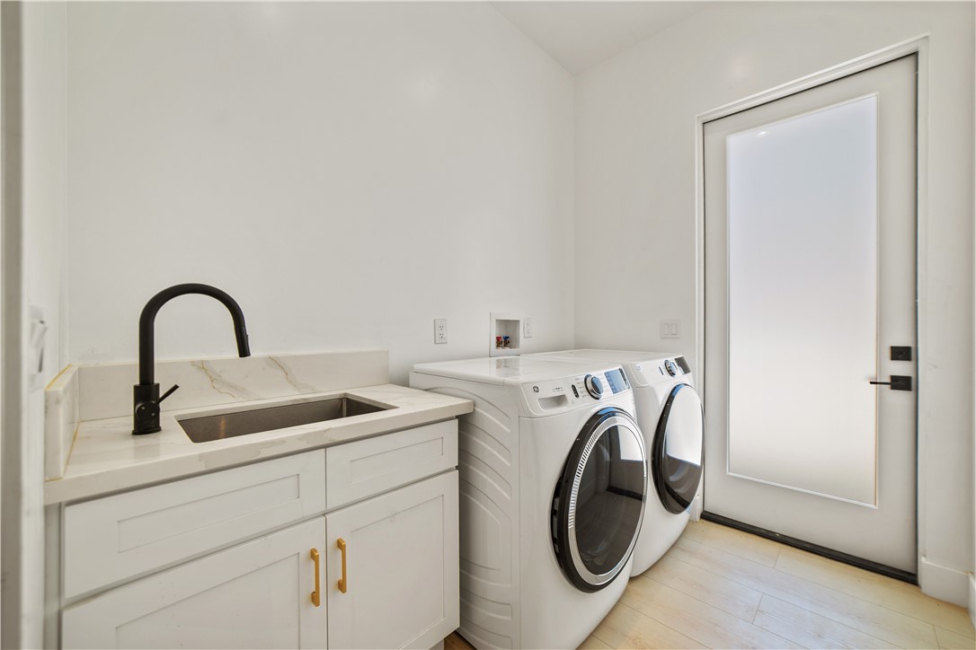 2027 Vía Monserate Fallbrook, CA 92028 - Photo 54 of 66 a utility room with dryer and washer