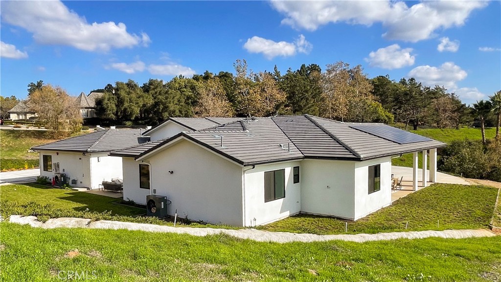 2027 Vía Monserate Fallbrook, CA 92028 - Photo 61 of 66 a aerial view of a house with a yard table and chairs