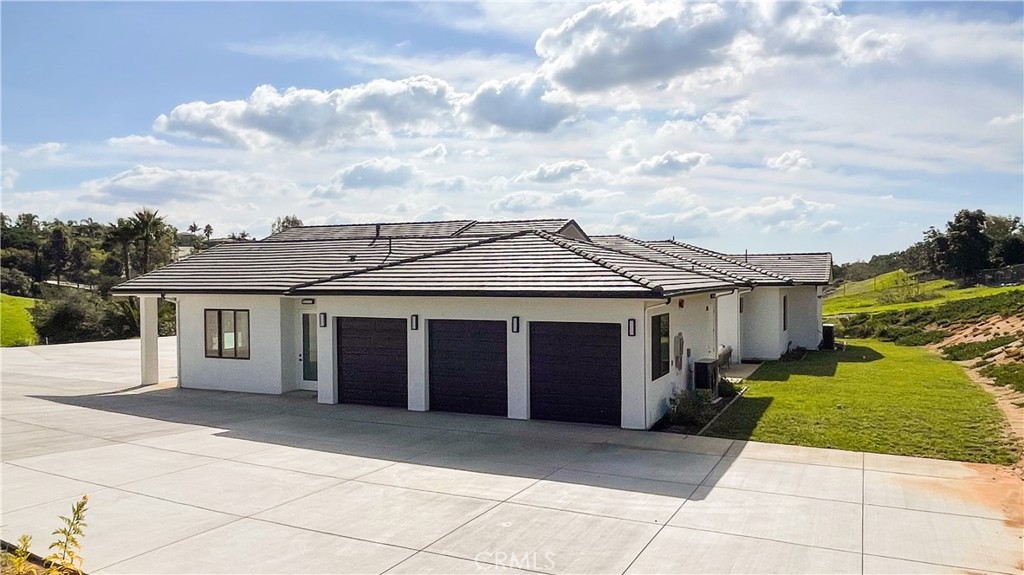 2027 Vía Monserate Fallbrook, CA 92028 - Photo 62 of 66 a view of a house with a yard
